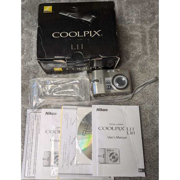Nikon Coolpix L11 DIGITAL CAMERA 6.0MP FOR PARTS ONLY powers on cracked screen - Picture 1 of 4